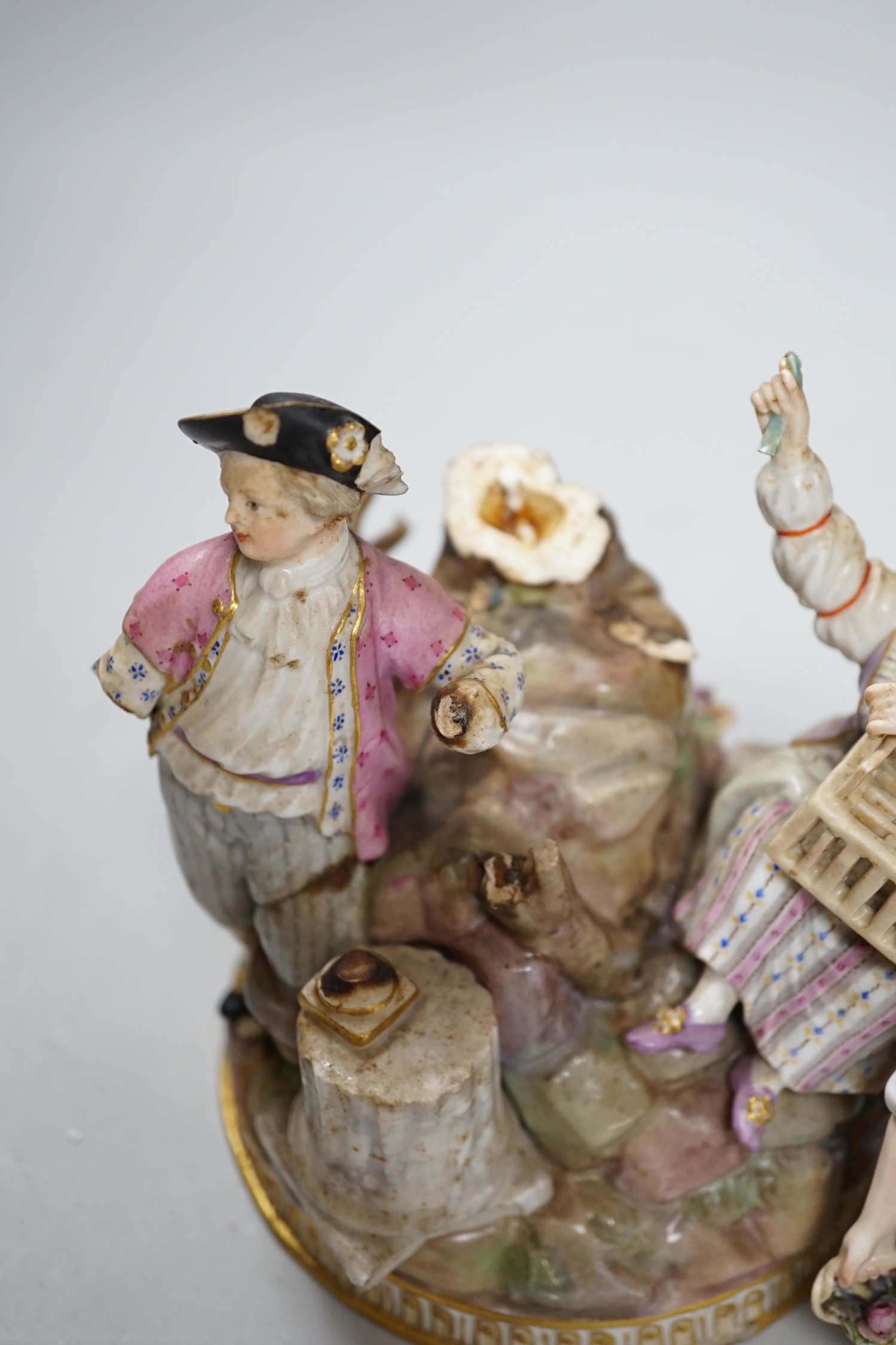 A Meissen group of flower pickers with bird cage, model F94 (a.f.)